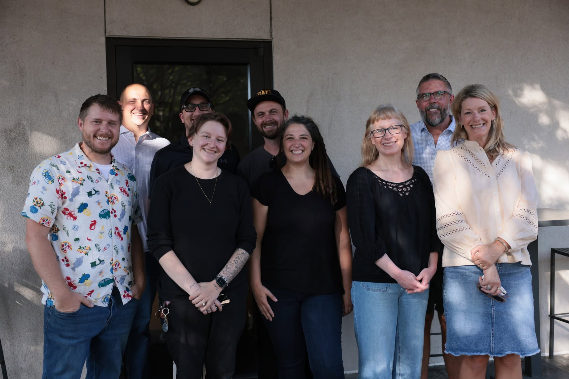 Neighbors smiling together outside at a ROOTED Middle Tennessee gathering